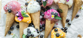 Ice cream cone on the table and berries